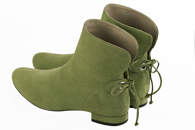 Pistachio green women's ankle boots with laces at the back. Round toe. Flat block heels. Rear view - Florence KOOIJMAN